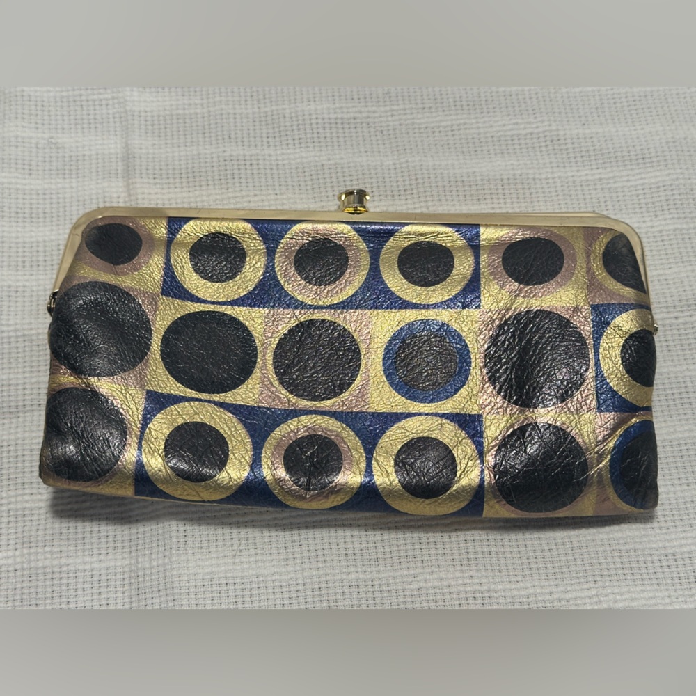 HOBO Circle Pattern Clutch in Black, Gold, and Blue